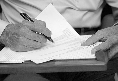 Dr. Yager's hands as he writes